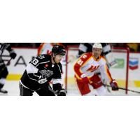 Ontario Reign's Tobias Bjornfot And Calgary Wranglers' Kevin Rooney In Action