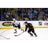 Victoria royals' Jake Poole and Vancouver Giants' Ty Thorpe in action