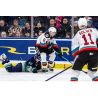 Kelowna Rockets' John Babcock, Carson Golder and Seattle Thunderbirds' Kyle Crnkovic in action