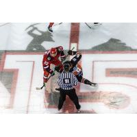 Rapid City Rush forward Matt Marcinew (left) in the faceoff circle