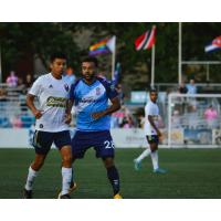 Forward Madison FC midfielder Andrew Wheeler-Omiunu (right)