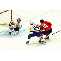 Saskatoon Blades' Ethan Chadwick and Matthew Sanders battle Regina Pats' Riley Ginnell