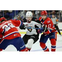 Vancouver Giants' Connor Dale battles Spokane Chiefs' Cole Wadsworth and Carter Streek