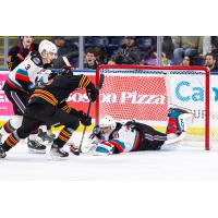 Kelowna Rockets' Ismail Abougouche and Jari Kykkanen in action