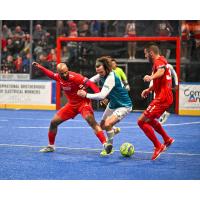 Kansas City Comets' Ray Lee battles St. Louis Ambush's Brian Bement