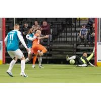 St. Louis Ambush's Christian Briggs battles the Florida Tropics' Rafa Alves