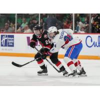 Belleville Senators centre Brennan Saulnier (left) vs. the Laval Rocket