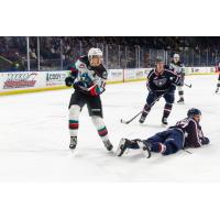 Kelowna Rockets left wing Adam Kydd (left) vs. the Tri-City Americans