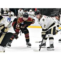 Bismarck Bobcats forward Julian Beaumont (right) vs. the Minot Minotauros