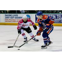 Texas Stars' Will Butcher and Bakersfield Condors'Noah Philp in action