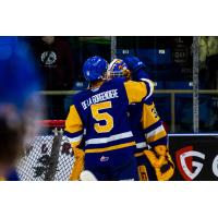 Saskatoon Blades' Aidan De La Gorgendiere and Ethan Chadwick celebrate win