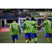 Seattle Sounders FC react after a goal in their MLS season opener