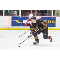 Vancouver Giants' Ty Thorpe and Prince George Cougars' Caden Brown on the ice