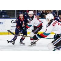 Kelowna Rockets left wing Carson Golder (right) vs. the Kamloops Blazers