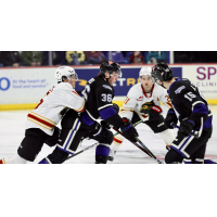 Victoria Royals' Alex Edwards and Ryan Spizawka battle Vancouver Giants' Jaden Lipinski and Dylan Anderson