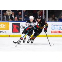 Kelowna Rockets' Jackson DeSouza versus Vancouver Giants' Jaden Lipinski