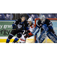 Victoria Royals' Kalem Parker and Nicholas Cristiano and Prince George Cougars' Cayden Glover in action