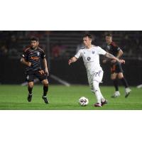 Orange County SC's Kevin Partida and Louisville City FC's Cameron Lancaster on game night