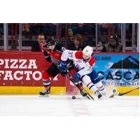 Kelowna Rockets' Turner McMillen battles Spokane Chiefs' Cameron Parr