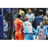 Ricardo Carvalho of the Florida Tropics (left) elevates for a header