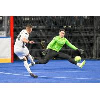 Florida Tropics forward Julio Varela takes a shot on Kansas City goaltender Nicolau Neto