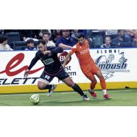 St. Louis Ambush forward Duduca Carvalho (left) vs. the Florida Tropics