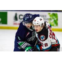 Seattle Thunderbirds' Luke Prokop battles Kelowna Rockets' Andrew Cristall