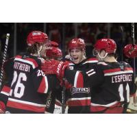 Grand Rapids Griffins' Jasper Weatherby, Wyatt Newpower and Joel L'Esperance celebrate win