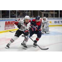 Guelph Storms' Jake Murray battles Saginaw Spirit's Bode Stewart