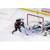 Vancouver Giants' Justin Ivanusec battles Kelowna Rockets' Jari Kykkanen