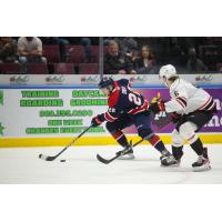 Saginaw Spirit defenseman Mitchell Smith with the puck