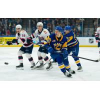 Saskatoon Blades' Egor Sidorov and Jordan Keller take on Regina Pats' Braxton Whitehead and Corbin Vaughan