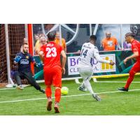 Kiel Williams of the Florida Tropics shoots against Baltimore Blast goaltender William Vanzela