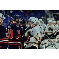 Vancouver Giants' Ty Thorpe congratulates Kamloops Blazers' Ryan Hofer