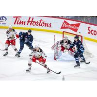 Grand Rapids Griffins' Wyatt Newpower, Donovan Sebrango and John Lethemon battle Manitoba Moose's Jeff Malott and Alex Limoges