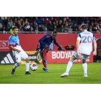 Chicago Fire FC's Kei Kamara versus Minnesota United FC's Franco Fragapaneo and Wil Trapp