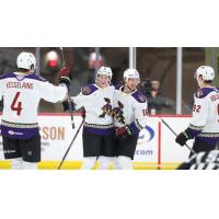 Tucson Roadrunners' Michael Kesselring, Lukas Klok, Ryan McGregor and Vladislav Kolyachonok celebrate win