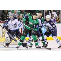 Texas Stars' Curtis McKenzie and Manitoba Moose's Oskari Salminen, Leon Gawanke and Jeff Malott on game night