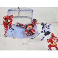 Rapid City Rush's Carter Robertson, Adam Carlson and Keanu Yamamoto battle Idaho Steelheads' Justin Ducharme