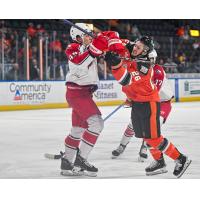 Zach Massicotte of the Allen Americans (left) tangles with the Kansas City Mavericks