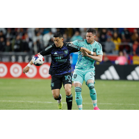 San Jose Earthquakes' Cristian Espinoza battles Real Salt Lake's Bryan Oviedo