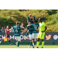 San Diego Loyal SC's Charlie Adams, Elliot Collier, Camden Riley and Tumi Moshobane celebrate win