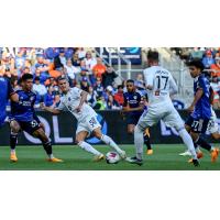 Louisville City FC's Rasmus Thellufsen and Cameron Lancaster battles FC Cincinnati's Ian Murphy and Stiven Jimenez