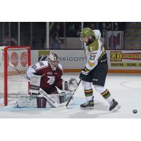 Peterborough Petes' Michael Simpson and North Bay Battalion's Pasquale Zito in action