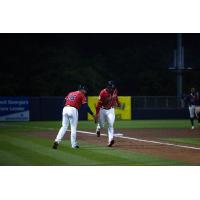 Rome Braves' coach Angel Flores congratulates Adam Zebrowski