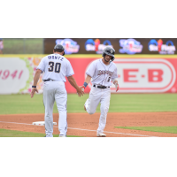 San Antonio Missions' coach Luke Montz congratulates Connor Hollis