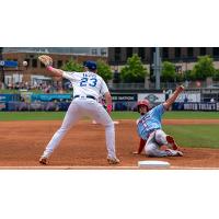 Tulsa Drillers first baseman Brandon Lewis receives the throw