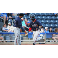 Mississippi Braves' manager Kanekoa Texeira congratulates Javier Valdes