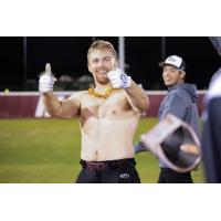 Shirtless Wisconsin Rapids Rafters catcher Levi Jensen after his walk-off hit