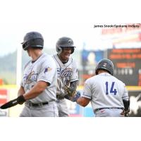 Tri-City Dust Devils' Werner Blakely congratulates Gustavo Campero